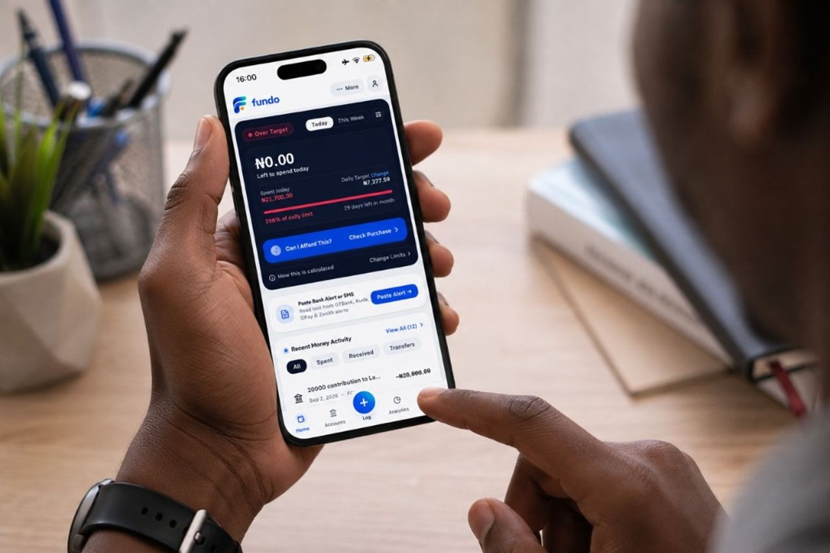 Woman using Fundo money tracker application on mobile phone